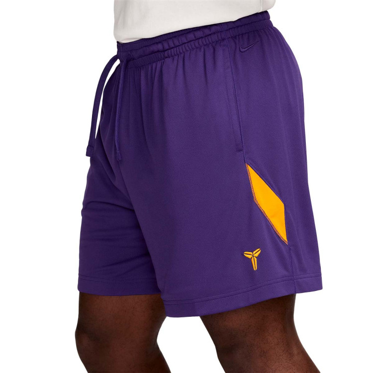 purple and yellow nike shorts